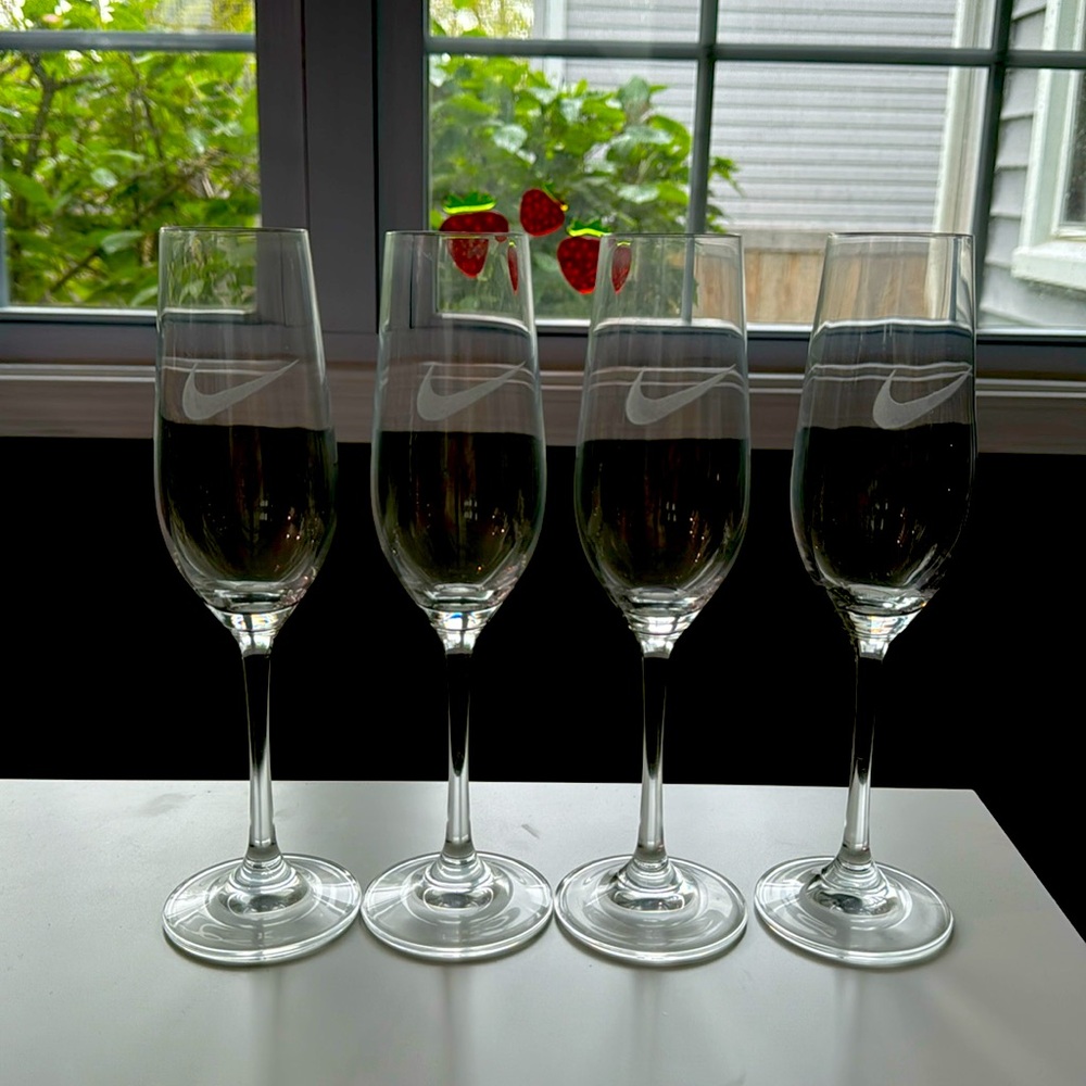Four (4) Nike Champagne glasses